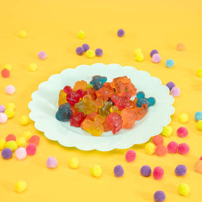 Disney gummies on a plate surrounded by little colorful balls