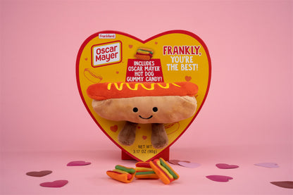 Hot dog heart box with attached hot dog plushy and gummy hot dogs in front 