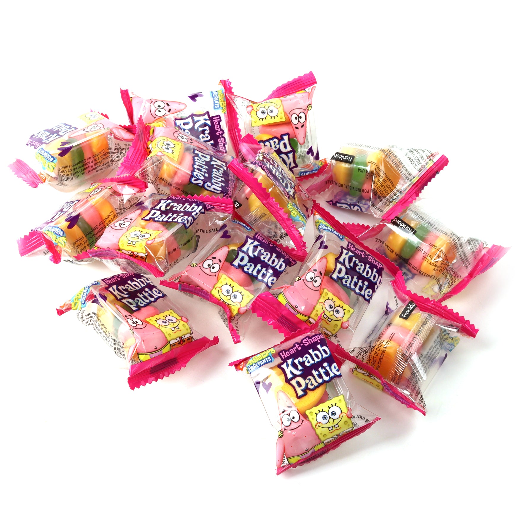 individually wrapped heart shaped gummy krabby patties in a pile 